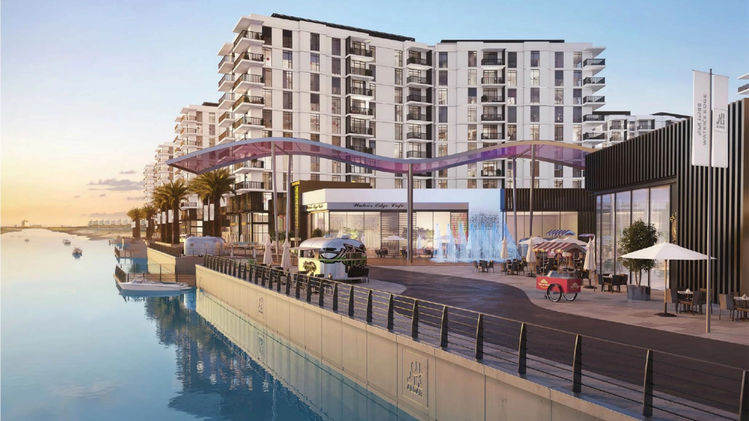 Water’s Edge residences overlooking the water with palm-lined promenades